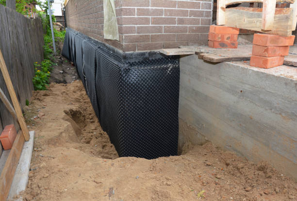 Happy homeowners after waterproofing job in Crum Lynne